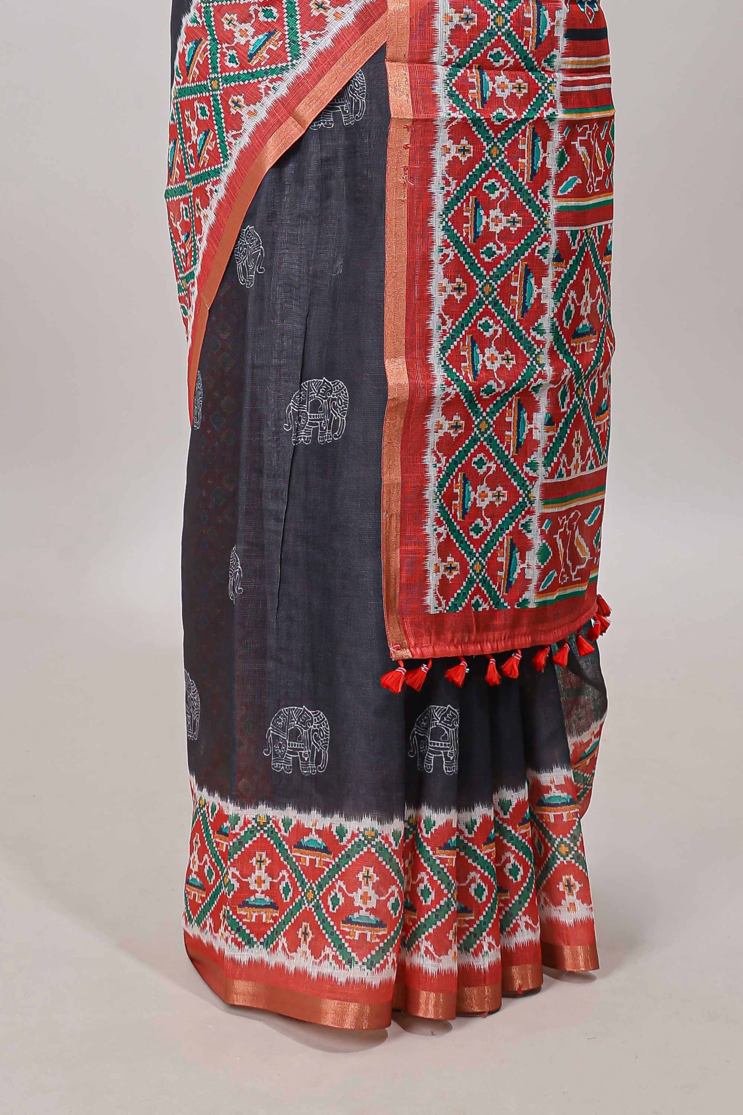 Black elephant motifs linen cotton saree with contrast ikkat style border and printed blouse