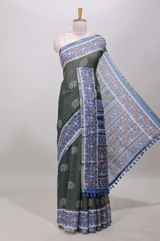Forest green elephant motifs linen cotton saree with contrast ikkat style border and printed blouse