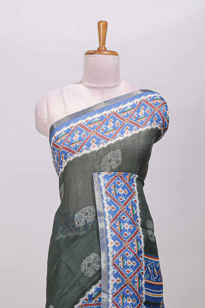 Forest green elephant motifs linen cotton saree with contrast ikkat style border and printed blouse