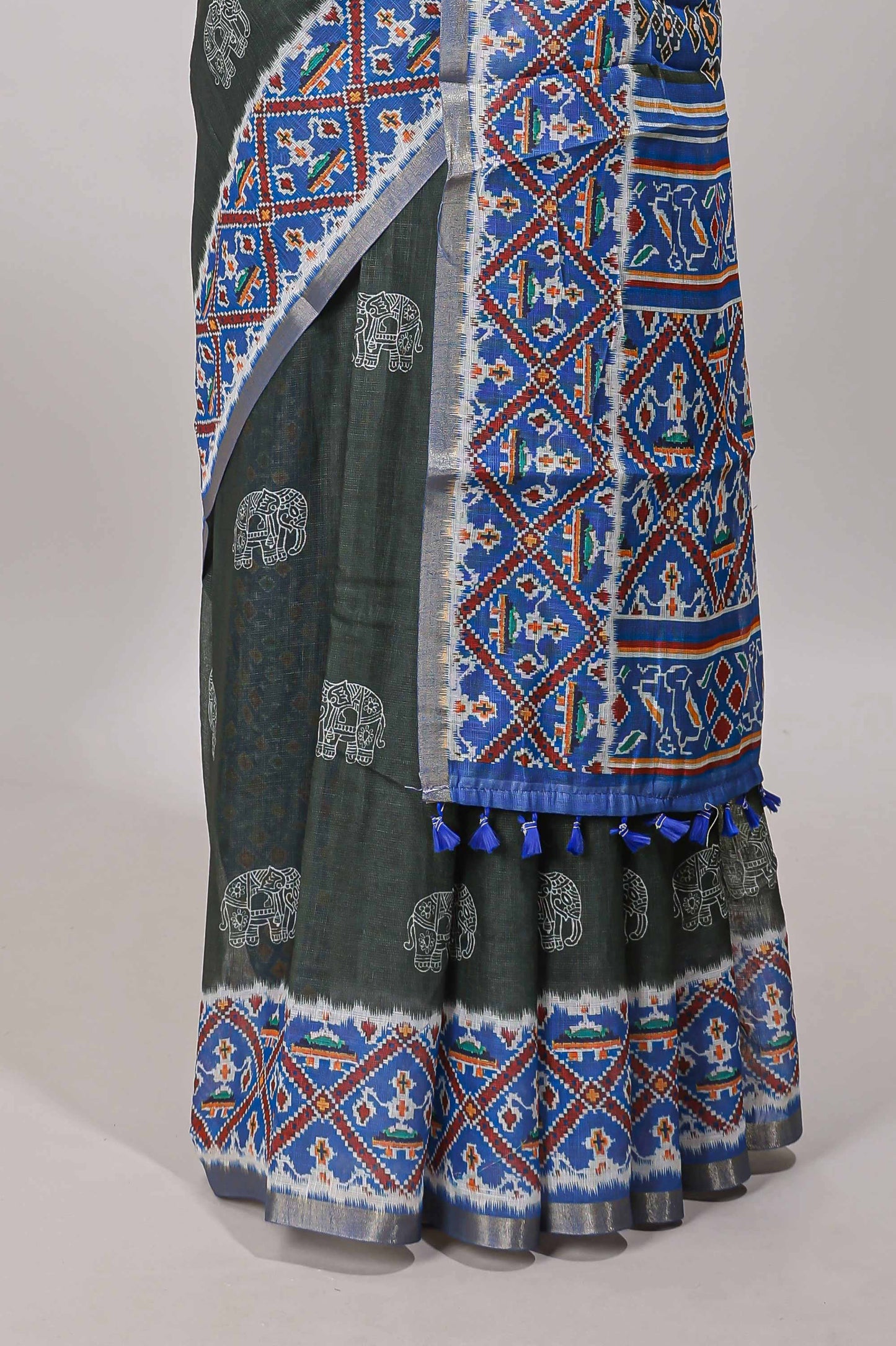 Forest green elephant motifs linen cotton saree with contrast ikkat style border and printed blouse