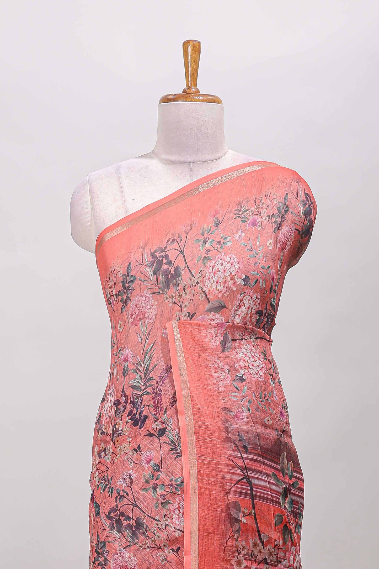 Orange floral design linen cotton saree with self zari border and floral printed pallu