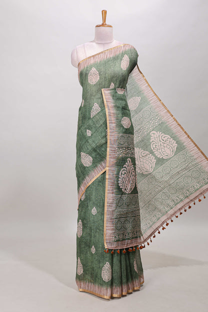 Green paisley motifs linen cotton saree with self zari border and matching blouse