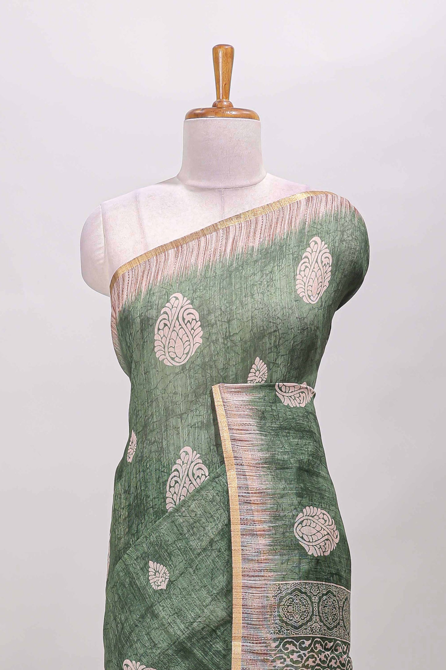 Green paisley motifs linen cotton saree with self zari border and matching blouse