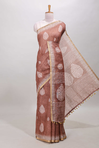 Brown paisley motifs linen cotton saree with self zari border and matching blouse