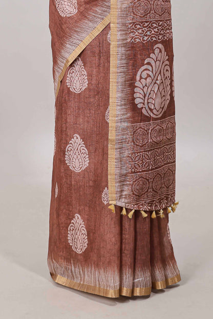 Brown paisley motifs linen cotton saree with self zari border and matching blouse