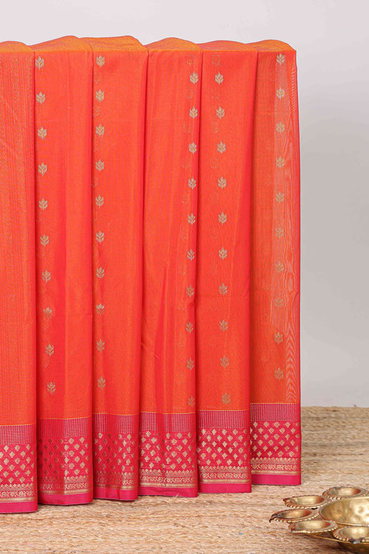 Orange floral zari butta semisilk cotton saree with contrast zari border and striped pallu