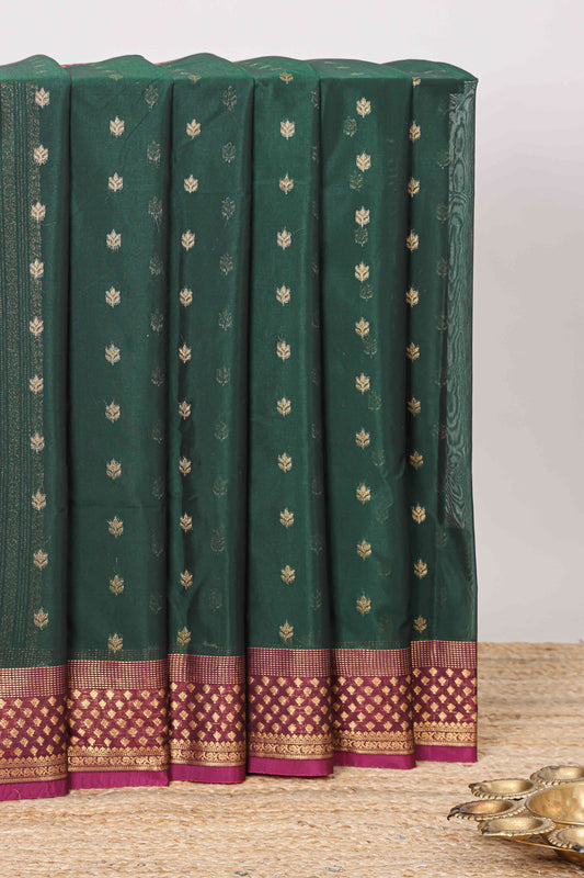Green floral zari butta semisilk cotton saree with contrast zari border and striped pallu