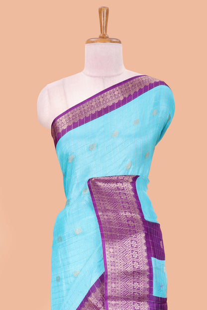 Blue viscose dola silk saree with all over checked butta design, contrast zari border and pallu