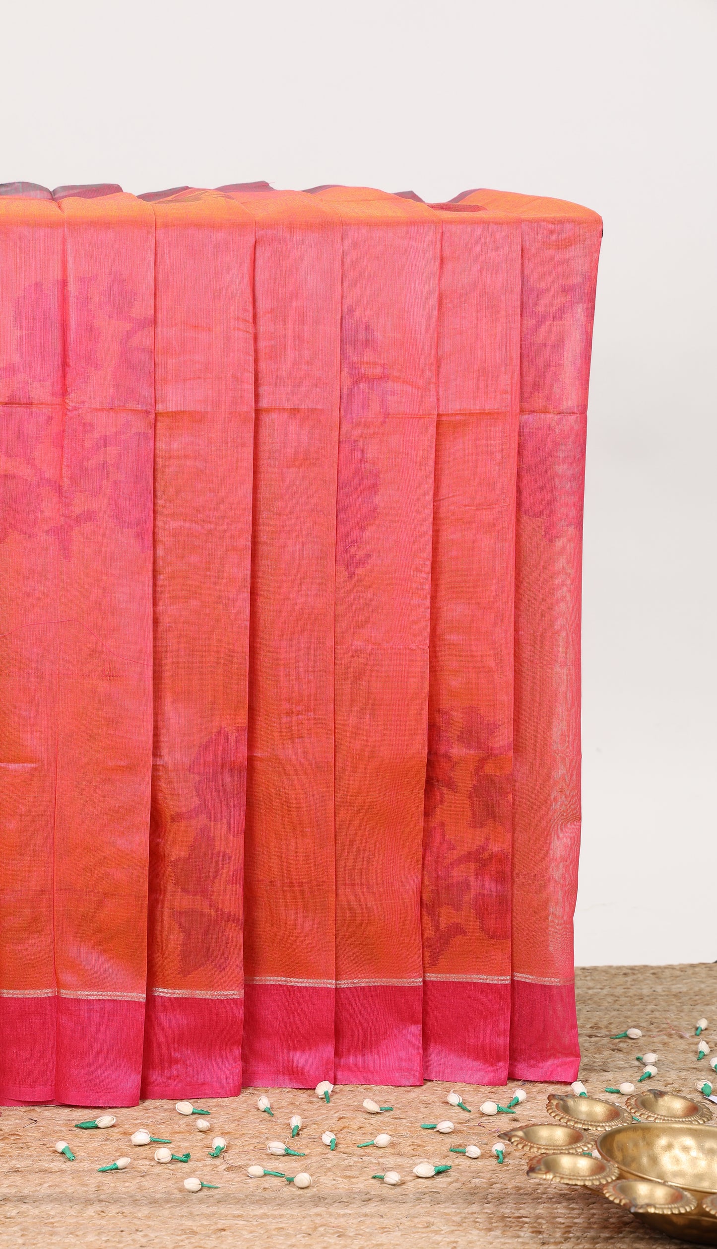 Orange floral motifs ikkat cotton saree with contrast border floral design striped pallu