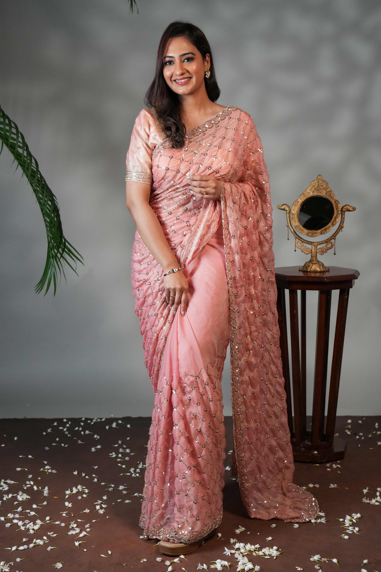 Peach geometric pattern stone work all over body designer saree with scallop design border matching blouse
