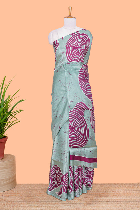 Green khadi cotton saree with adire batik print on body and pallu with matching blouse