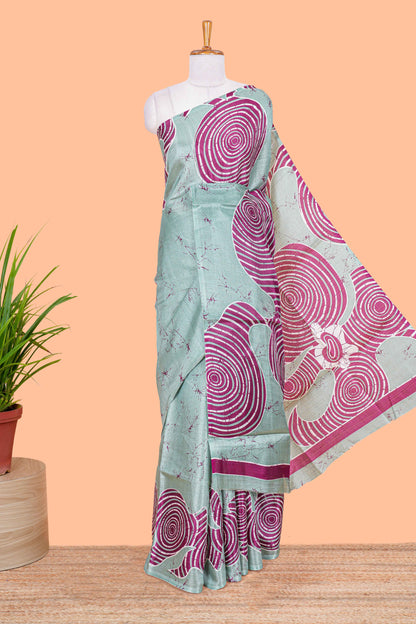 Green khadi cotton saree with adire batik print on body and pallu with matching blouse