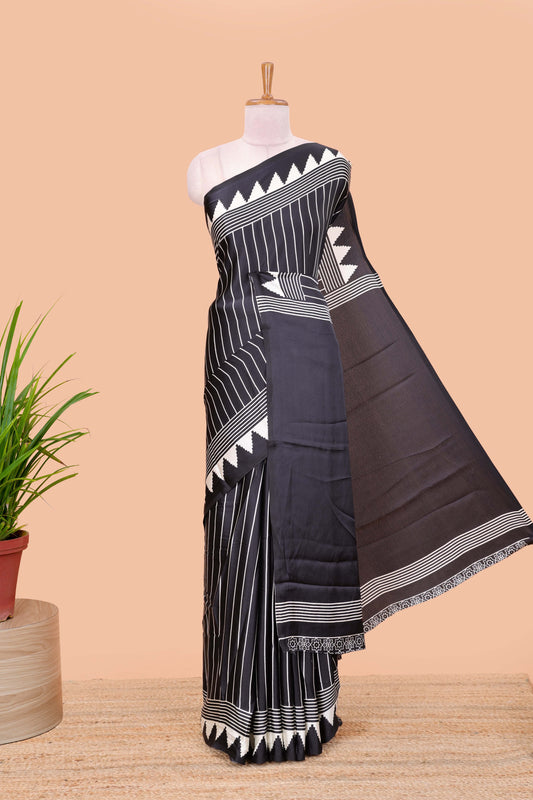 Black satin ajrakh modal printed saree with striped body and geometric print border and pallu