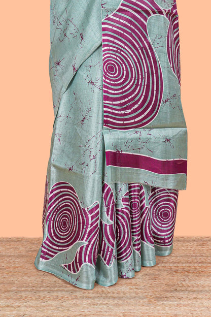 Green khadi cotton saree with adire batik print on body and pallu with matching blouse