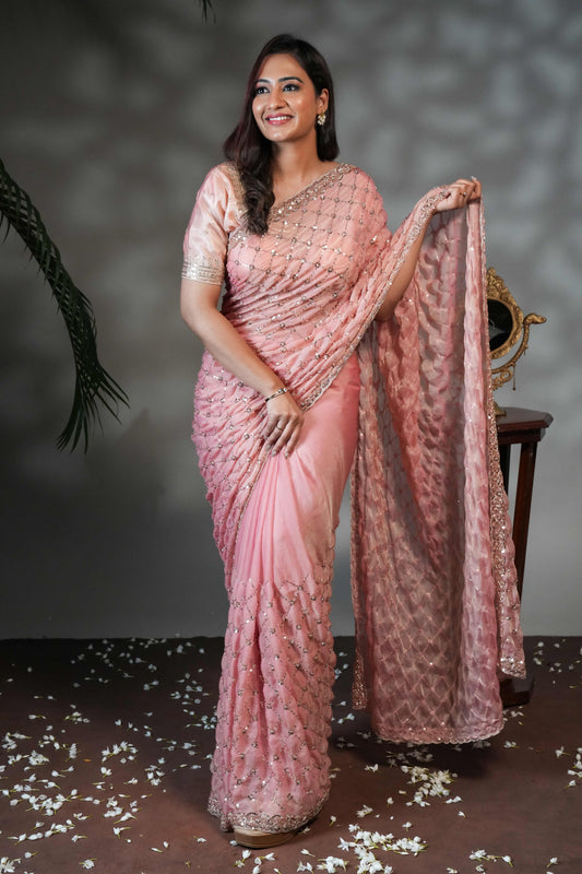 Peach geometric pattern stone work all over body designer saree with scallop design border matching blouse