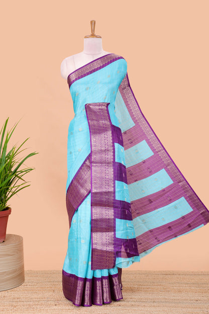 Blue viscose dola silk saree with all over checked butta design, contrast zari border and pallu