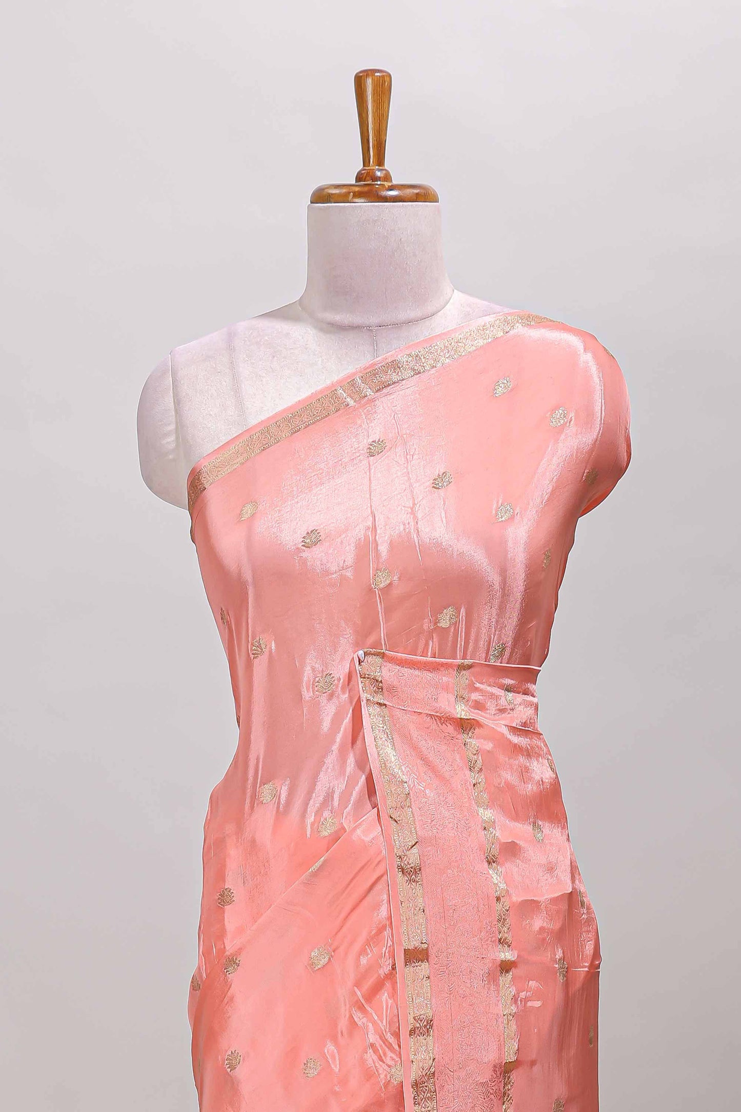 Peach zari butta dola silk saree with self zari border and matching blouse