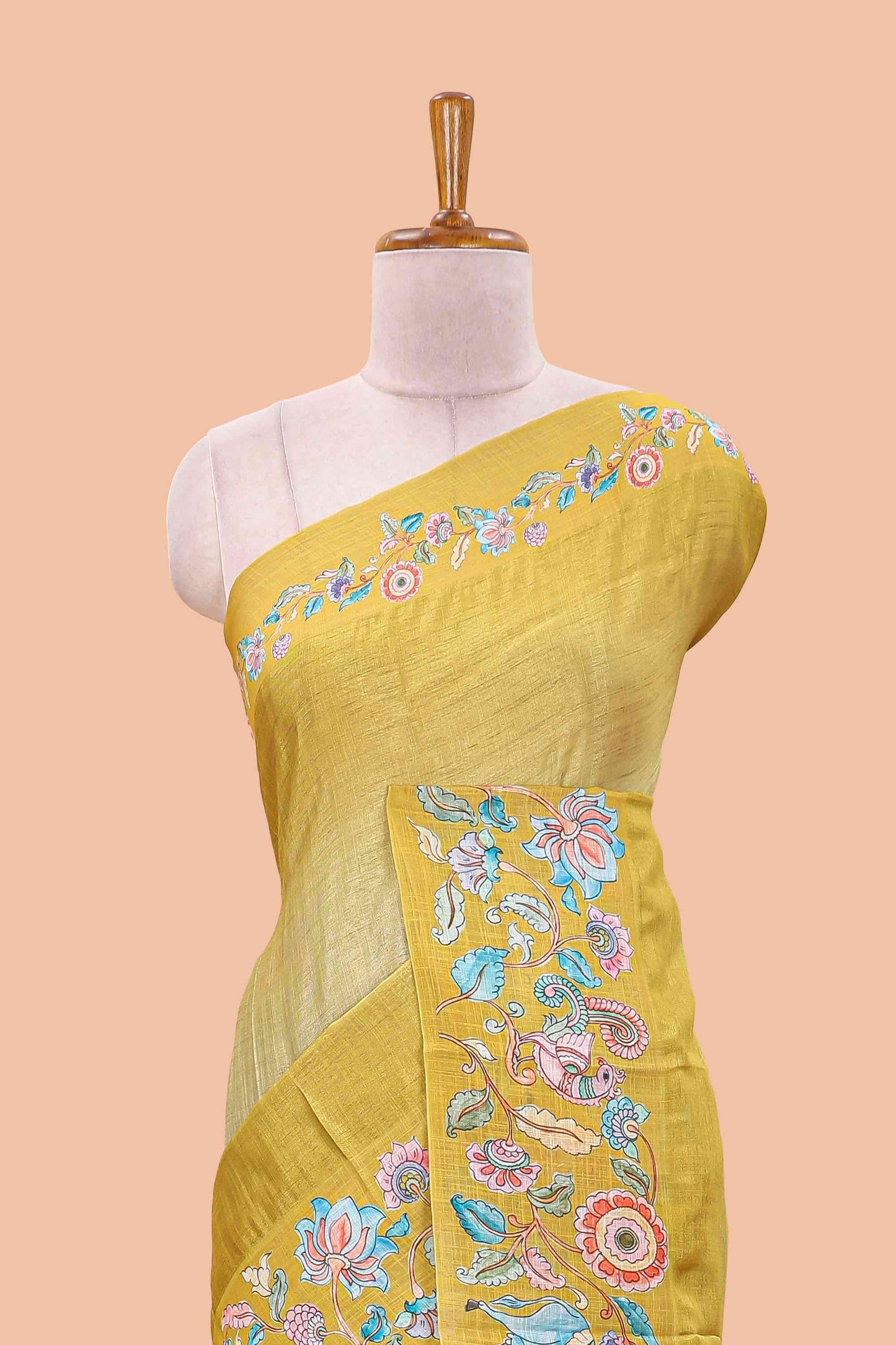 Lemon yellow linen tussar kalamkari style saree with animal floral border and pallu