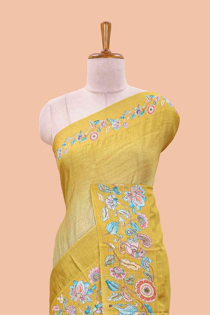 Lemon yellow linen tussar kalamkari style saree with animal floral border and pallu