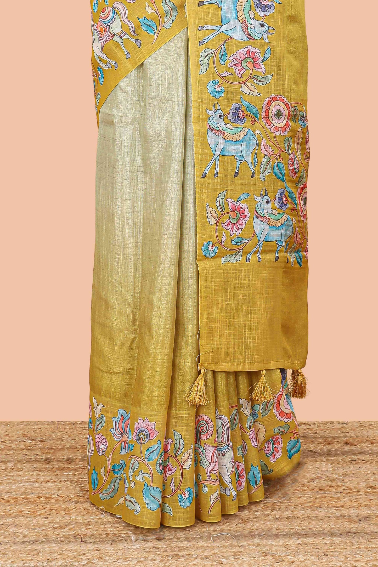 Lemon yellow linen tussar kalamkari style saree with animal floral border and pallu