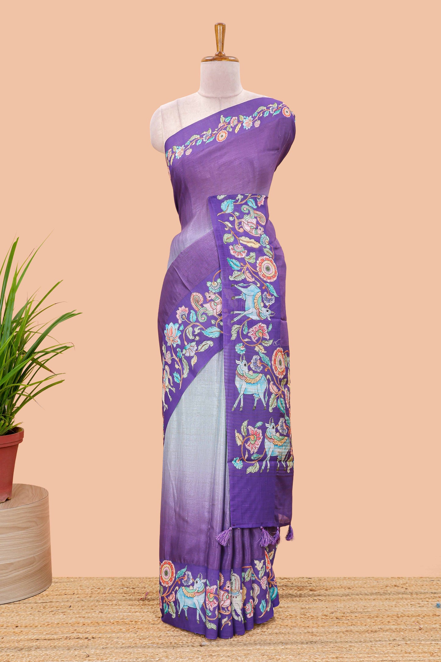 Purple linen tussar kalamkari style saree with animal floral border and pallu