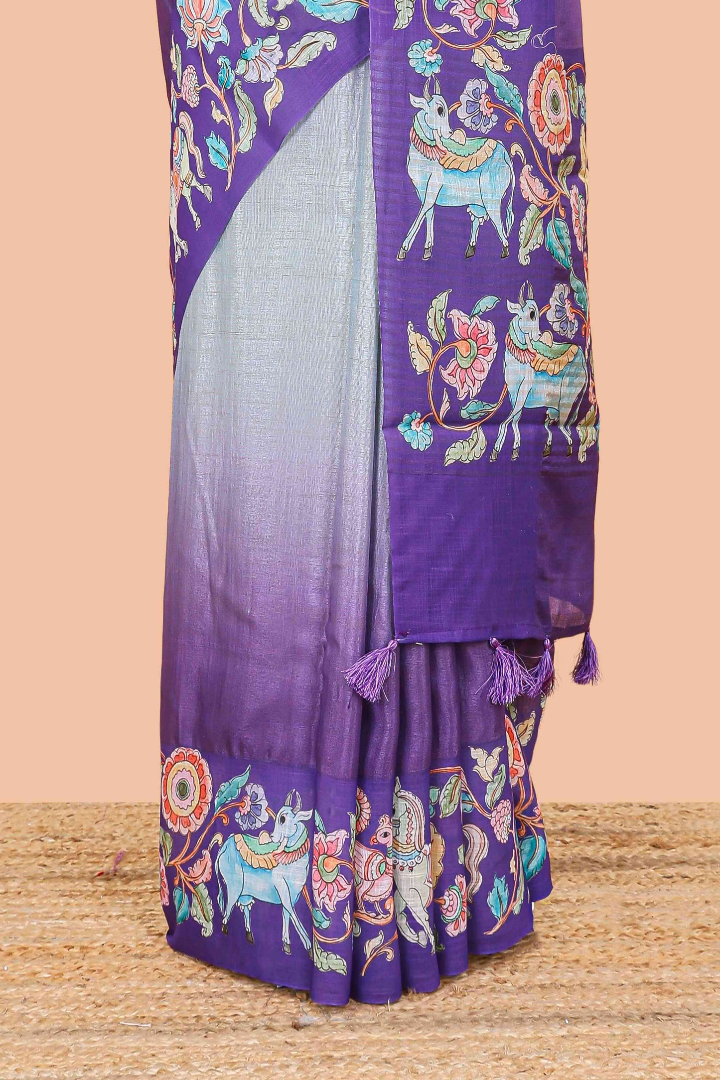 Purple linen tussar kalamkari style saree with animal floral border and pallu