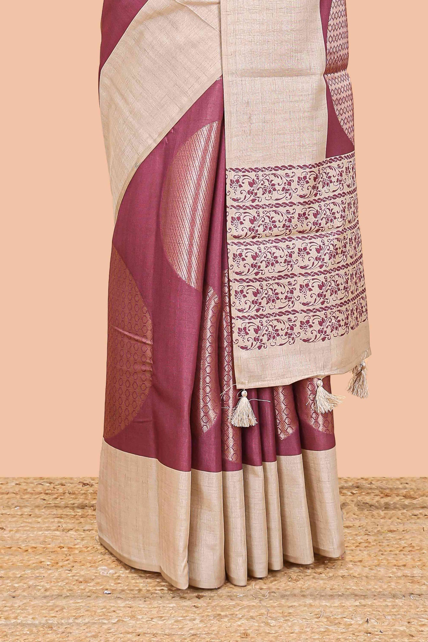 Maroon art tussar saree with large circular zari buttas and contrast cream floral pallu
