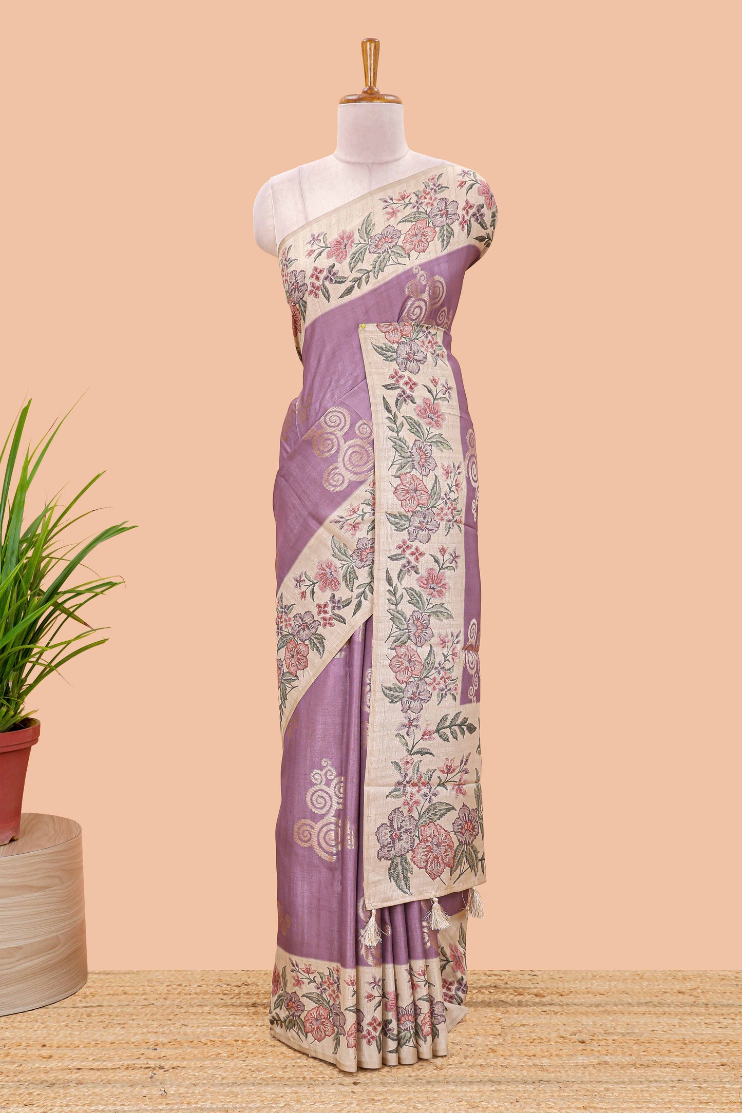 Lavender art tussar silk saree with rich floral zari butta weave and cream floral border and pallu