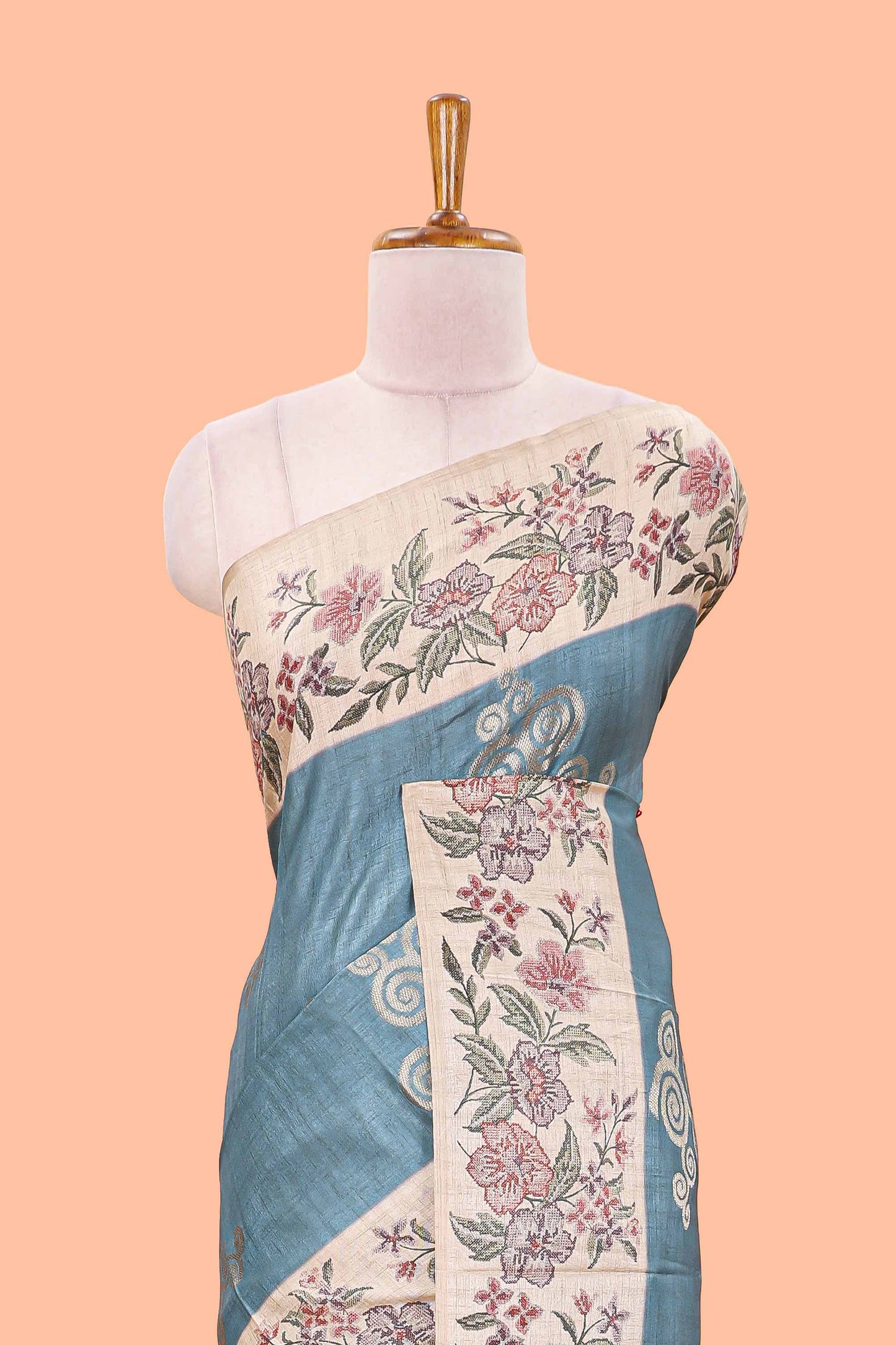 Blue art tussar silk saree with rich floral zari butta weave and cream floral border and pallu