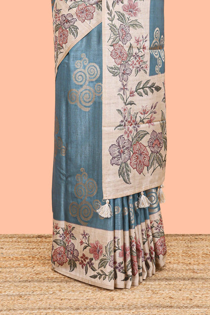 Blue art tussar silk saree with rich floral zari butta weave and cream floral border and pallu