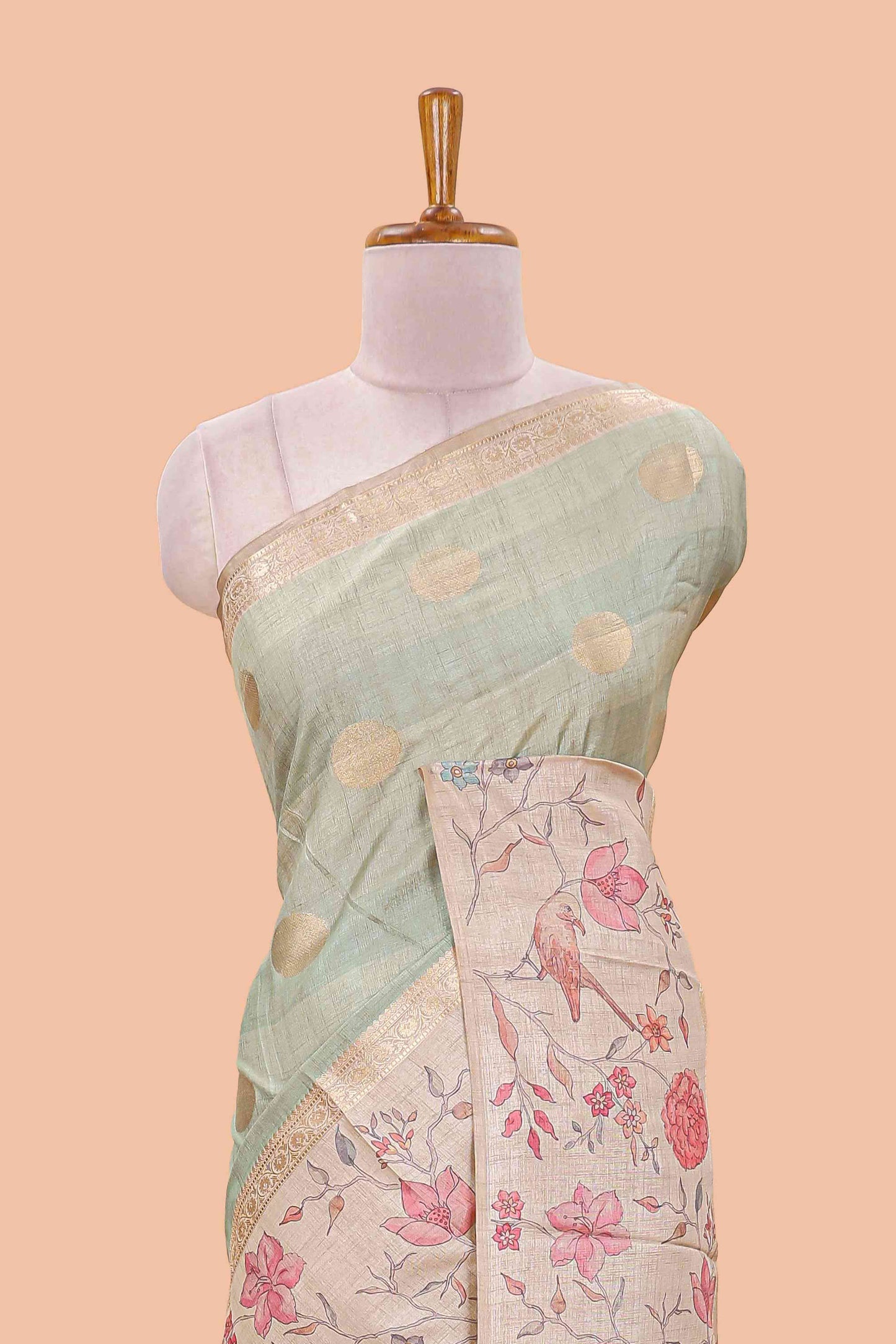 Pista green art tussar saree featuring round zari butta body with floral and bird motif printed border and pallu