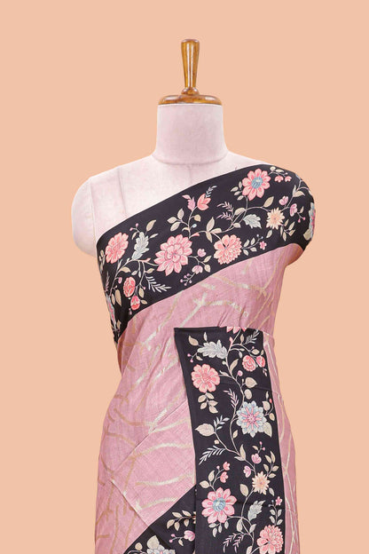 Peach art tussar saree with wave zari weaving body and black floral print border and pallu