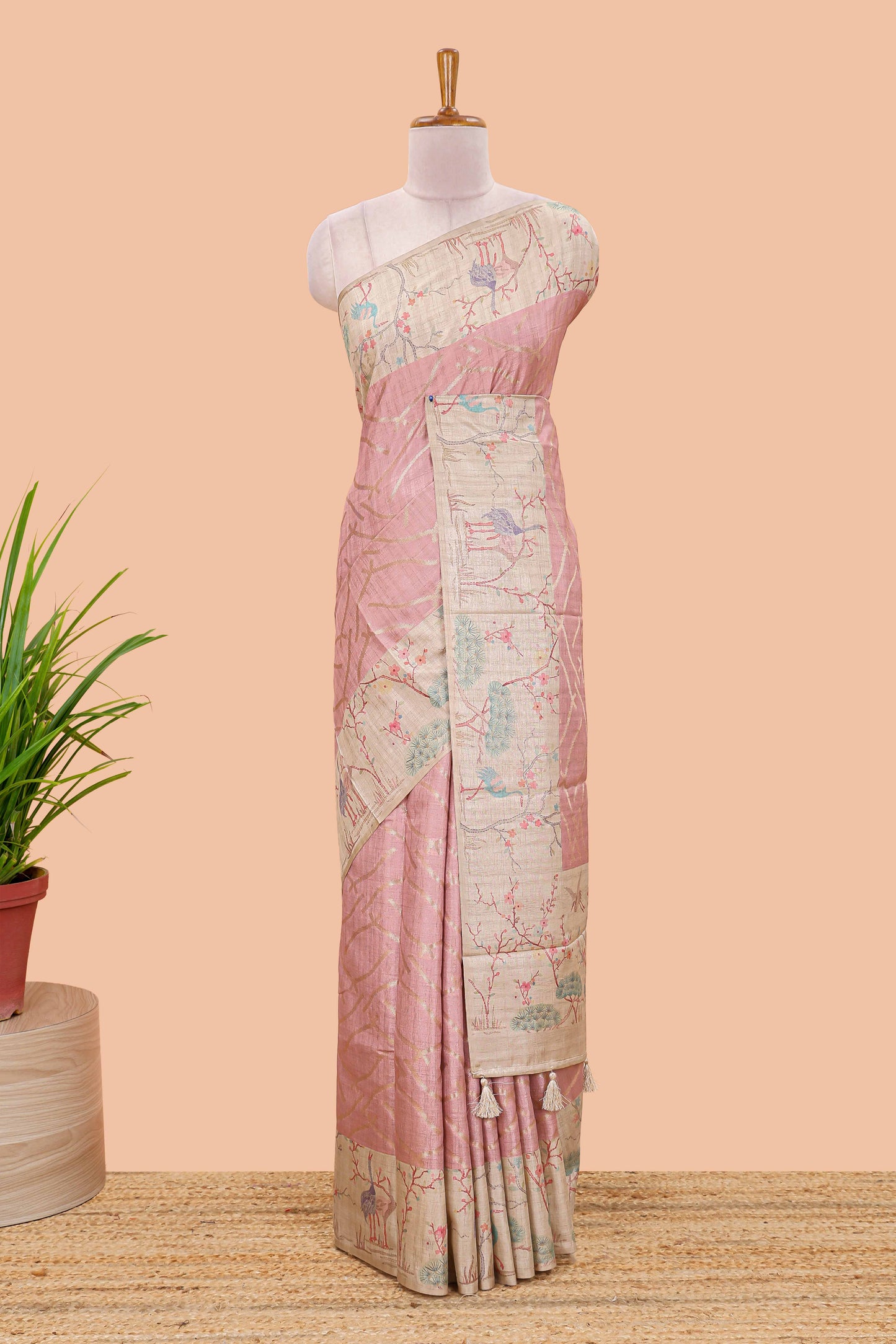 Peach art tussar saree with wave zari weaving body and cream nature print border & pallu