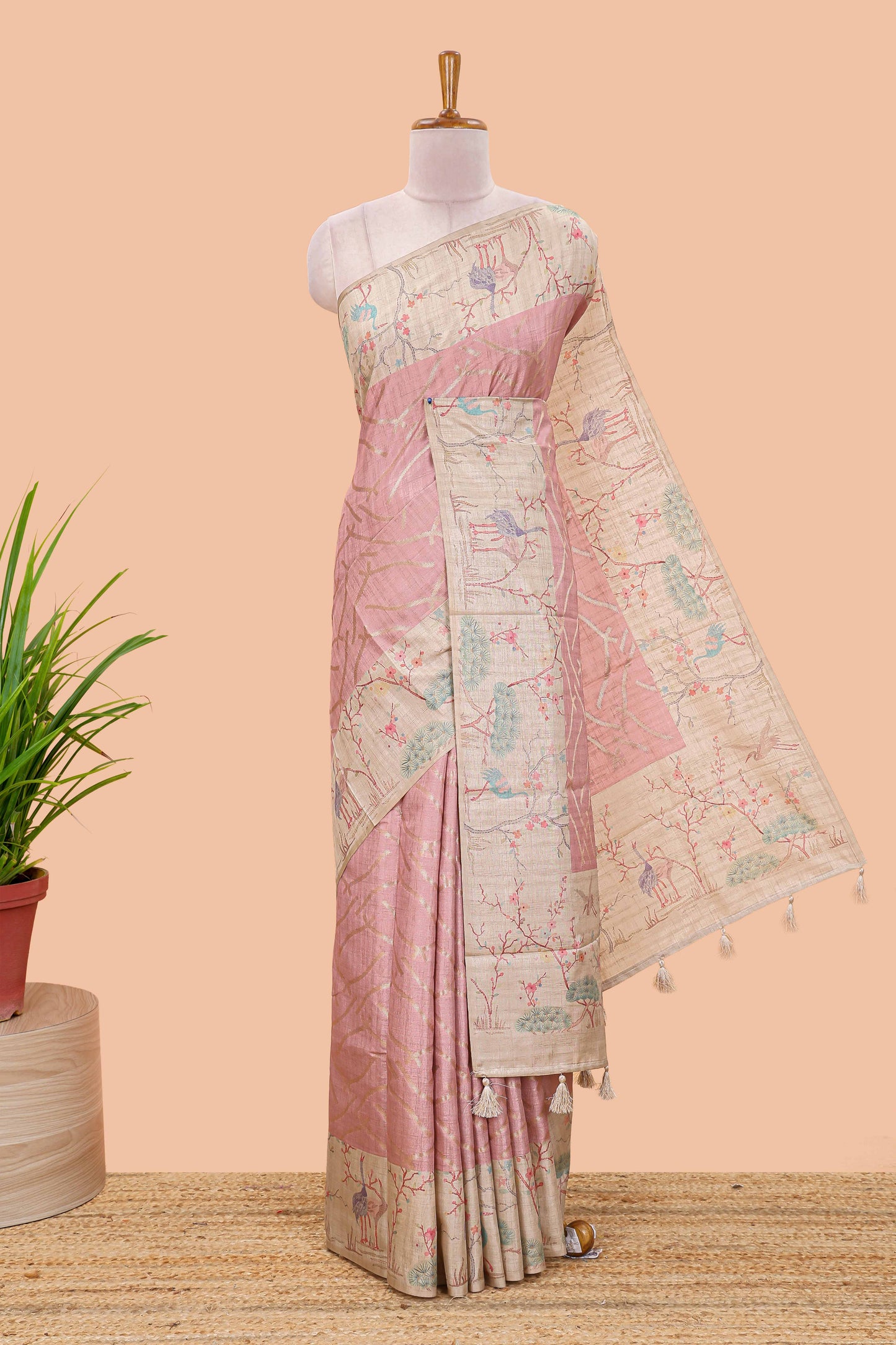 Peach art tussar saree with wave zari weaving body and cream nature print border & pallu