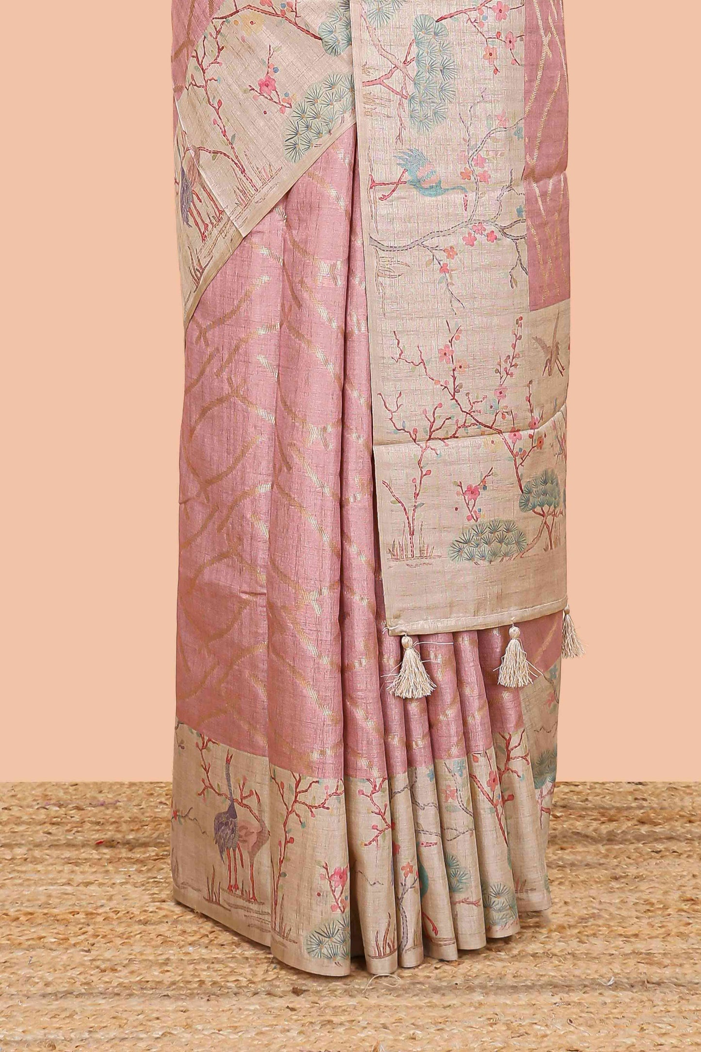 Peach art tussar saree with wave zari weaving body and cream nature print border & pallu