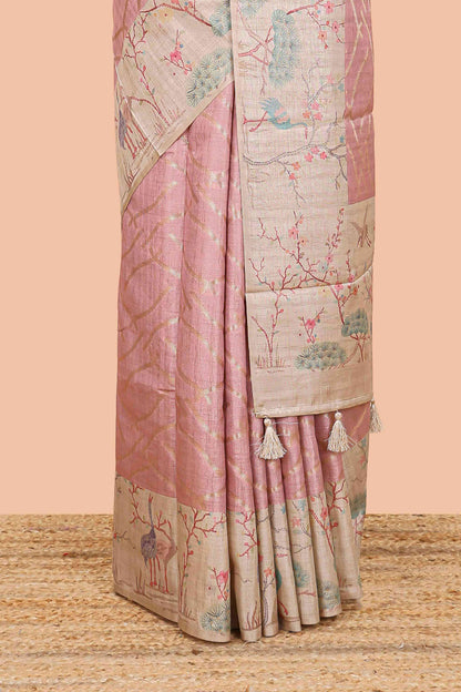 Peach art tussar saree with wave zari weaving body and cream nature print border & pallu