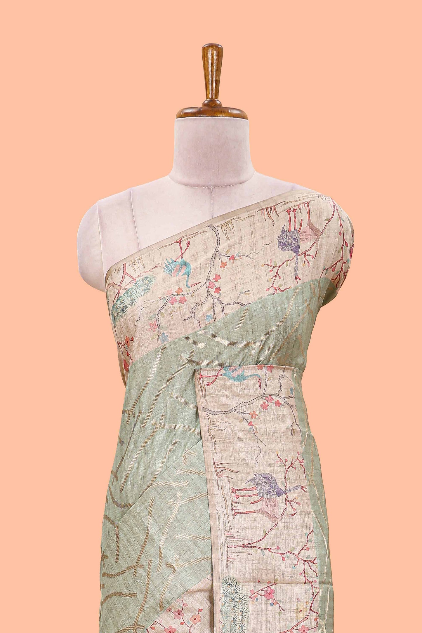 Green art tussar saree with wave zari weaving body and cream nature print border & pallu