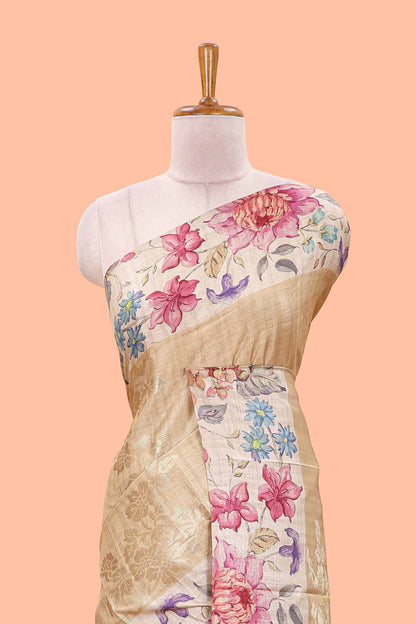 Sandal art tussar silk saree with floral zari butta body, cream border and floral print pallu