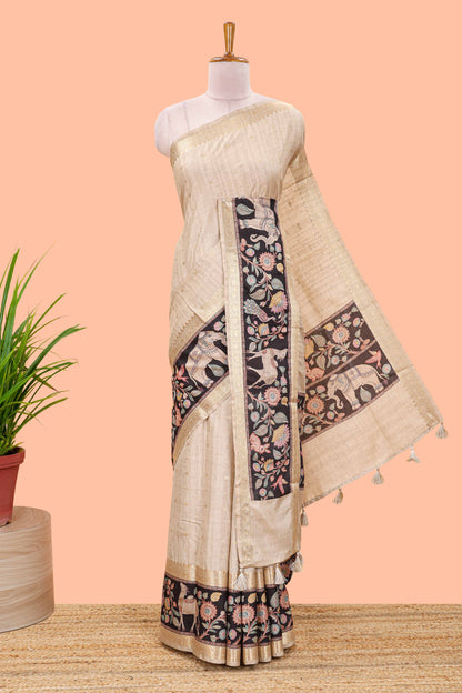 Beige art tussar silk saree featuring zari butta and Black retta-patta border with kalamkari animal designs