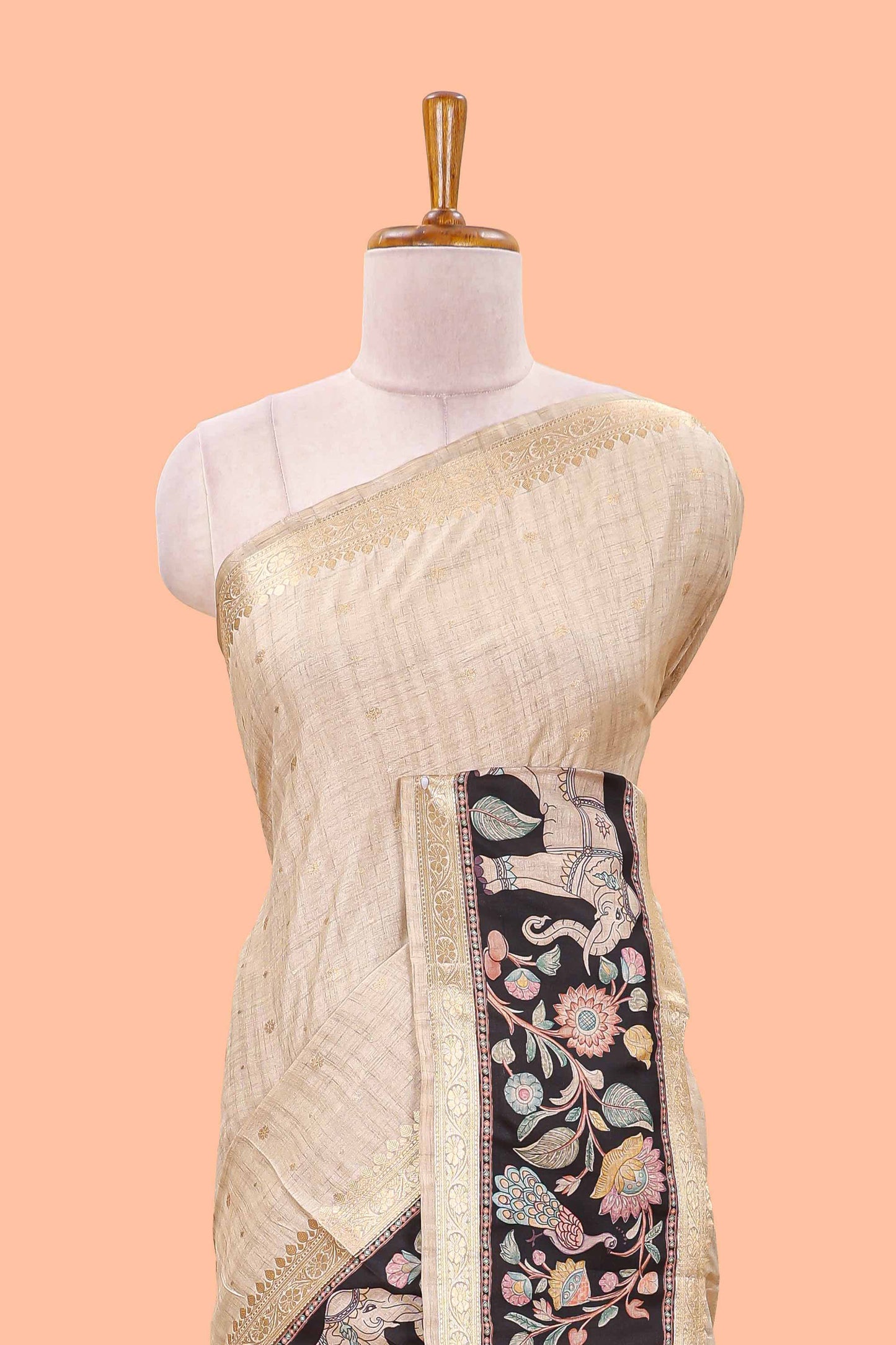 Beige art tussar silk saree featuring zari butta and Black retta-patta border with kalamkari animal designs