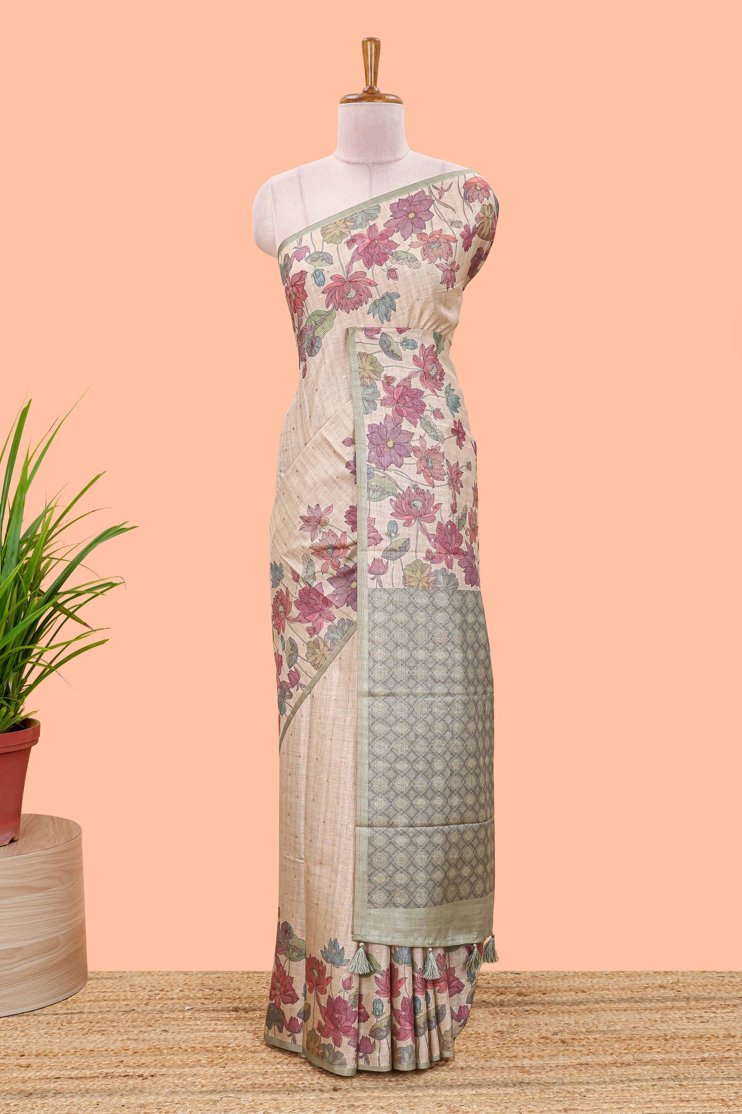 Beige art tussar silk saree with small zari butta weaving and floral print pale green border and pallu