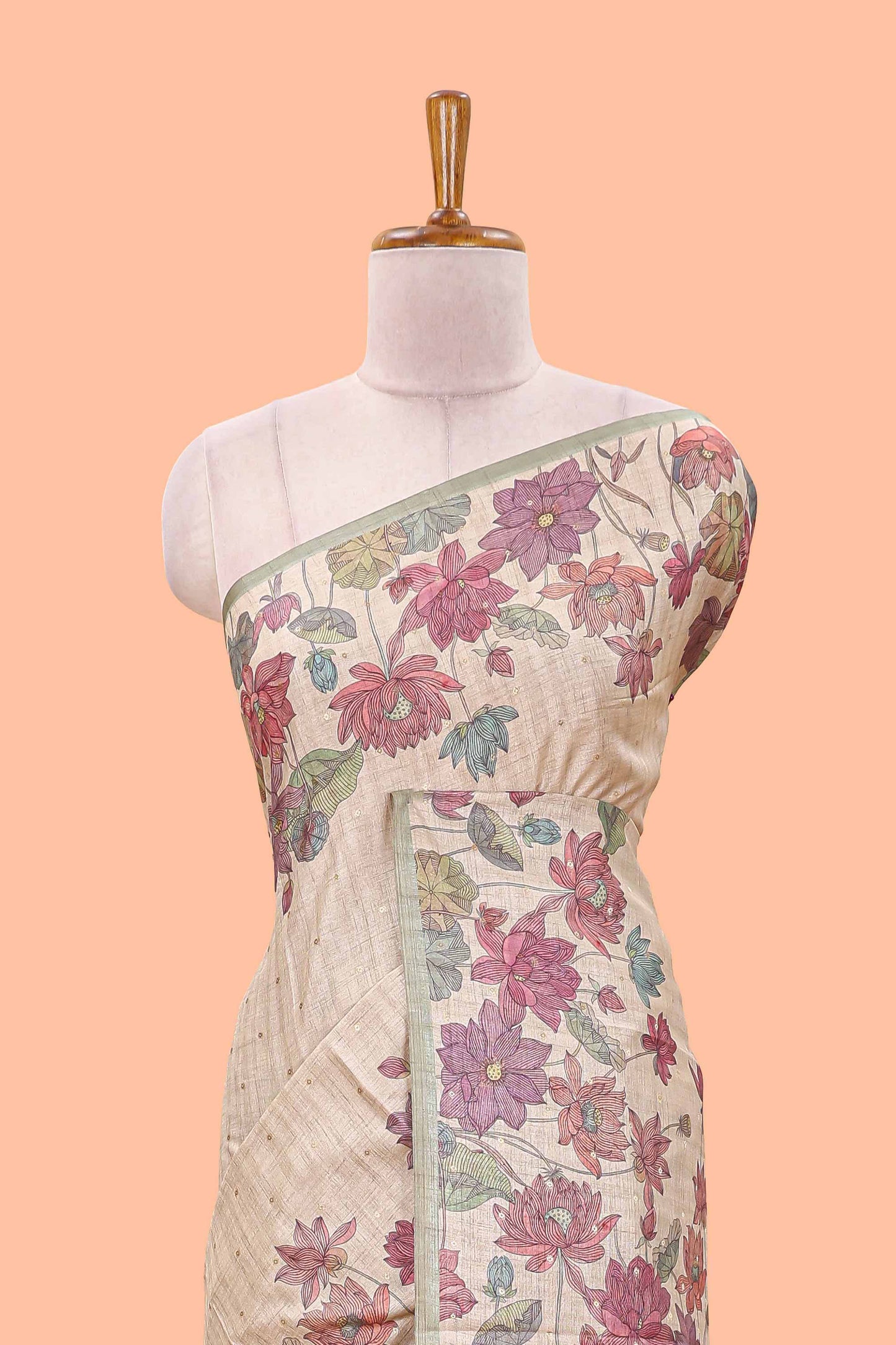 Beige art tussar silk saree with small zari butta weaving and floral print pale green border and pallu