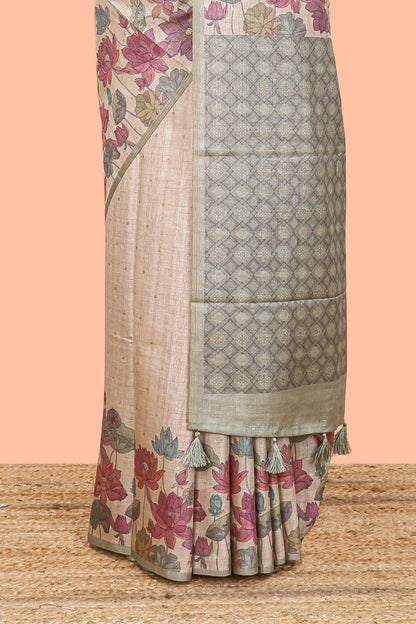 Beige art tussar silk saree with small zari butta weaving and floral print pale green border and pallu
