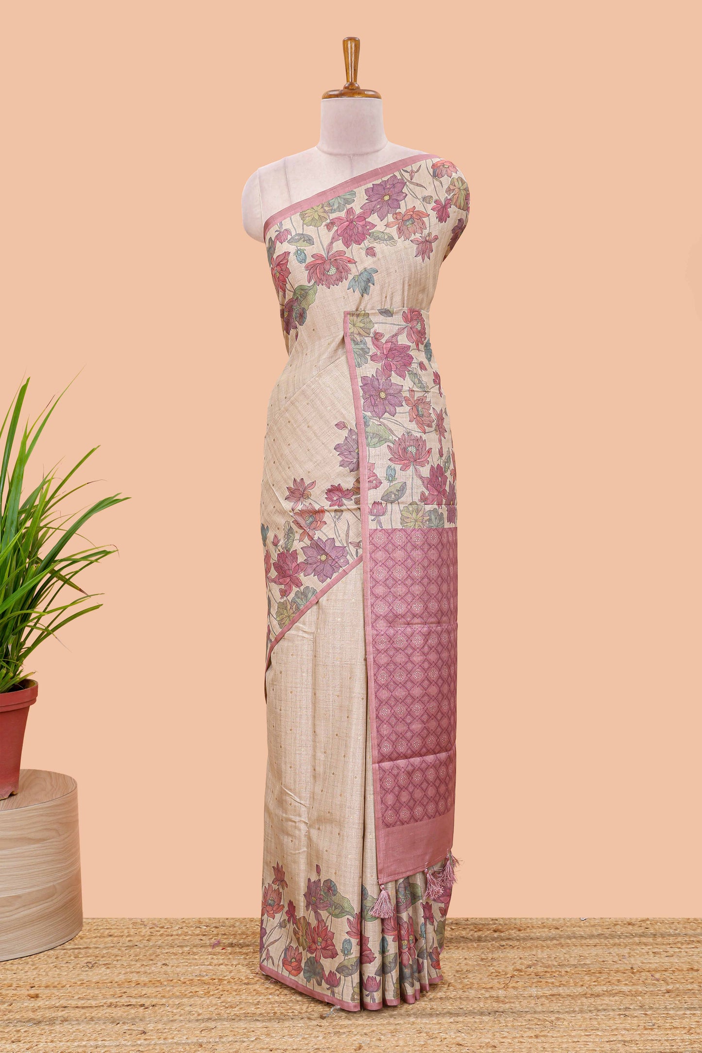Beige art tussar silk saree with small zari butta weaving and floral print border and pallu