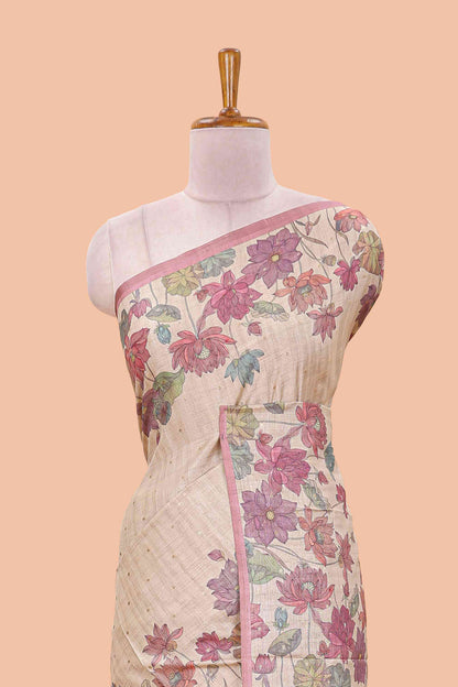 Beige art tussar silk saree with small zari butta weaving and floral print border and pallu