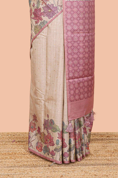 Beige art tussar silk saree with small zari butta weaving and floral print border and pallu
