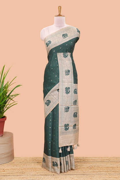 Green art tussar saree with zari check and butta weave, cream border and kalamkari elephant and peacock motif border and pallu