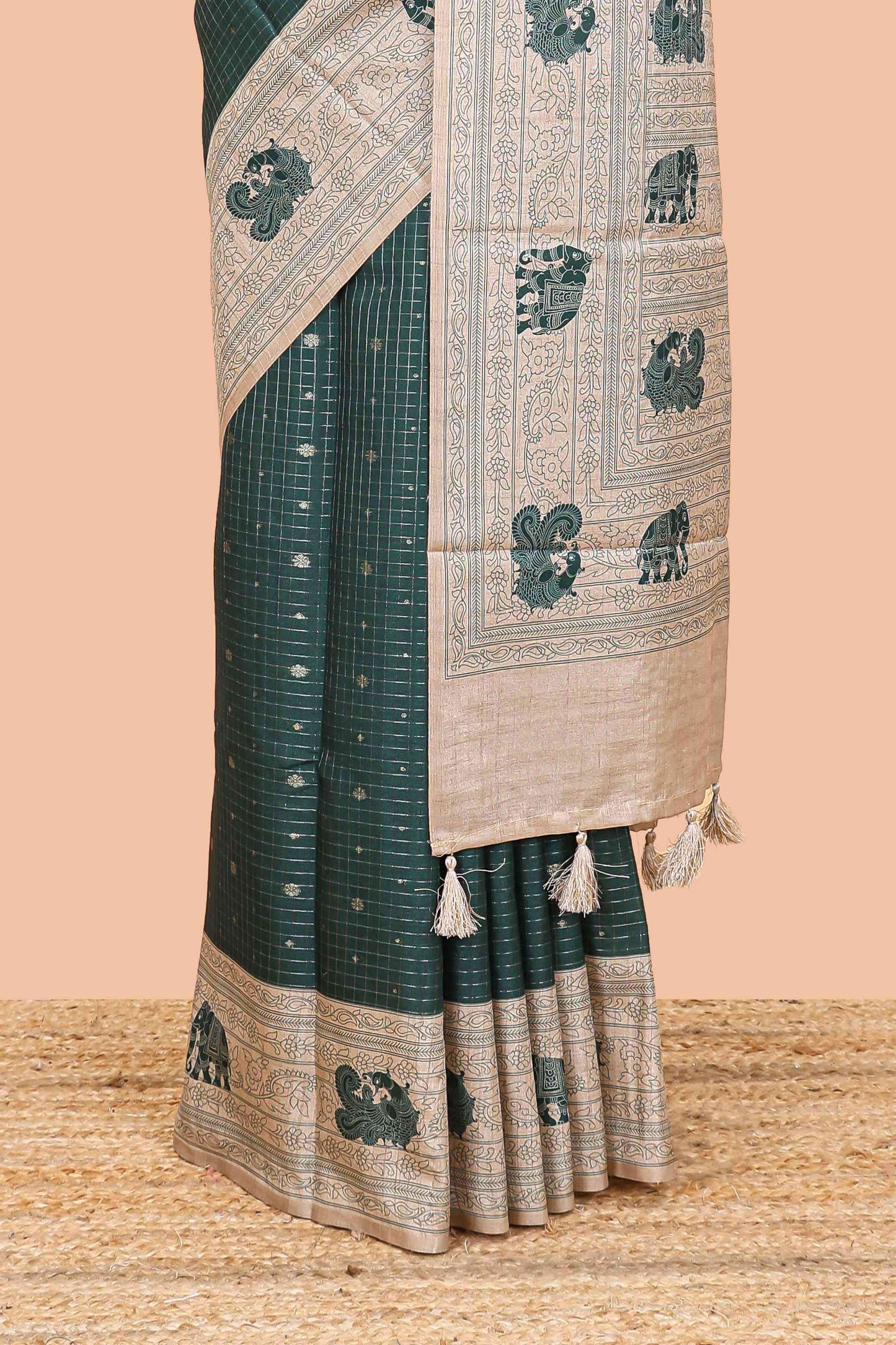 Green art tussar saree with zari check and butta weave, cream border and kalamkari elephant and peacock motif border and pallu