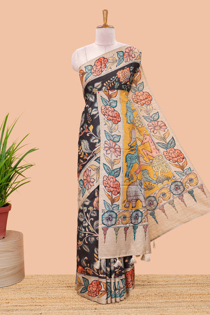 Black art tussar silk saree with leaf and floral printed body, cream border, and floral & animal print pallu