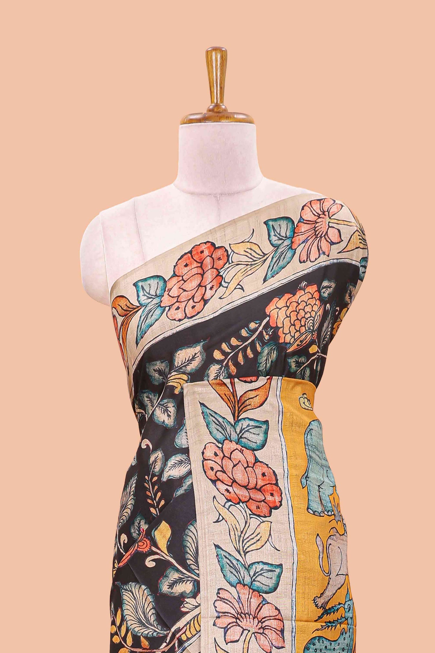 Black art tussar silk saree with leaf and floral printed body, cream border, and floral & animal print pallu